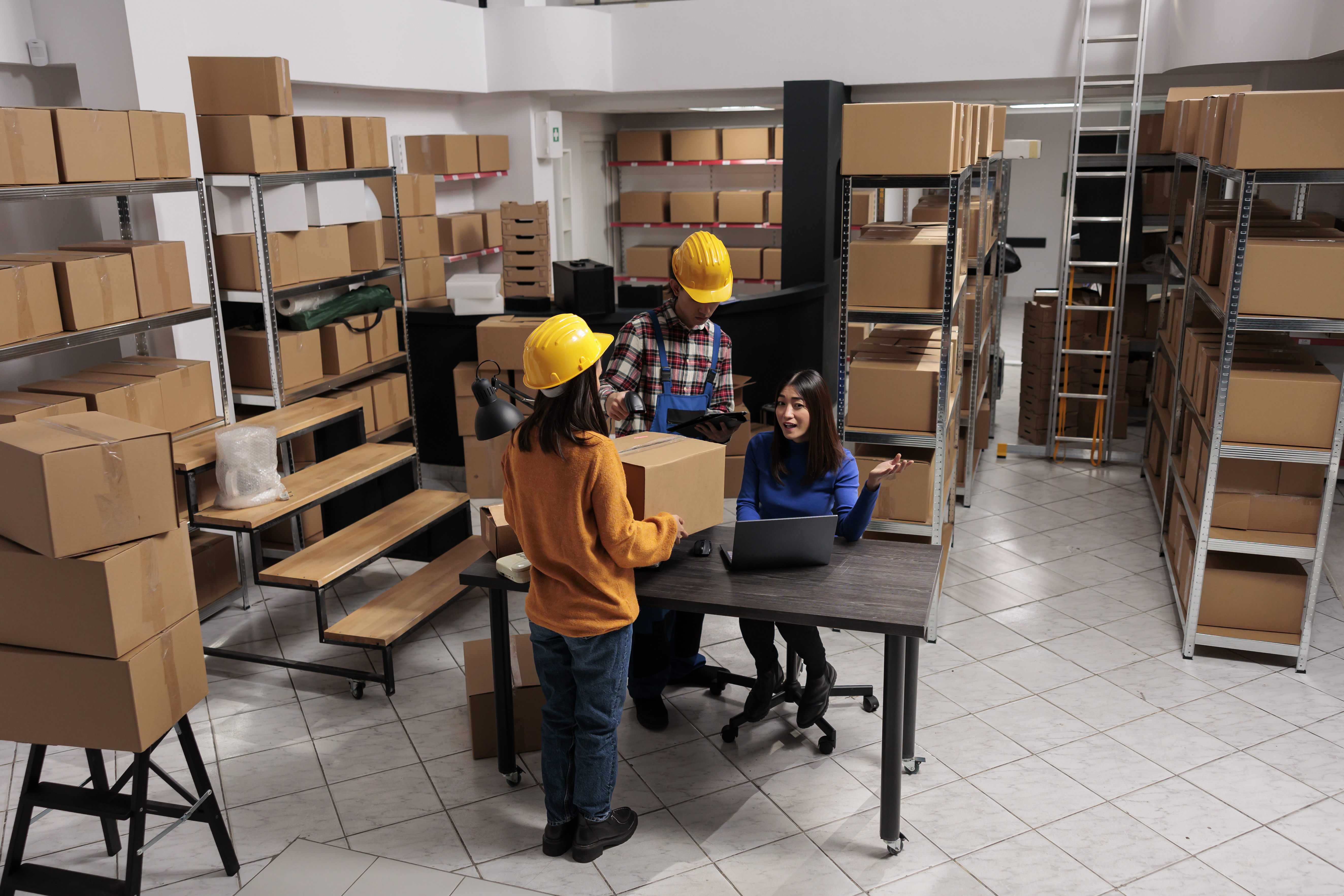 warehouse package handlers doing inventory control with logistics manager
